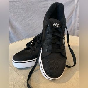 Like new black Heelys with white sole.